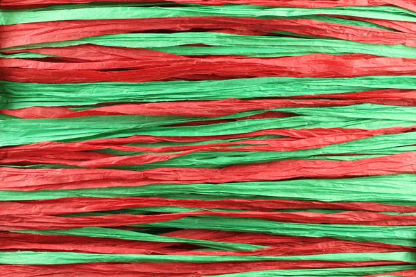 Háttér - rafia piros és zöld papír csíkok a párhuzamos vonalak — Stock Fotó