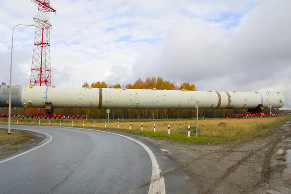 Transportation distillation column on the way to a petrochemical plant. Equipment for rectification