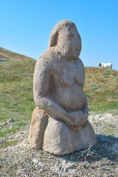 The statue of the pagan god. Stone idol.