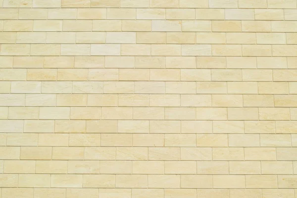 Hintergrund aus gelben Ziegeln. Wand aus gelben Ziegeln. die Textur der Wand. — Stockfoto