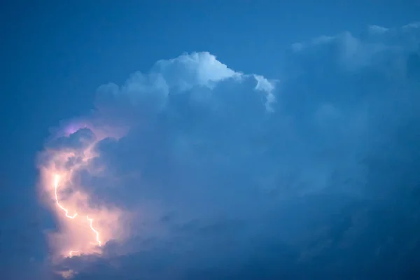 Lightnings in storm clouds. Peals of a thunder and the sparkling lightnings in clouds.