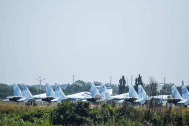 Krymsk, Russia - August 20, 2016: Fighter aircrafts. Military airfield and parking lots of planes clipart