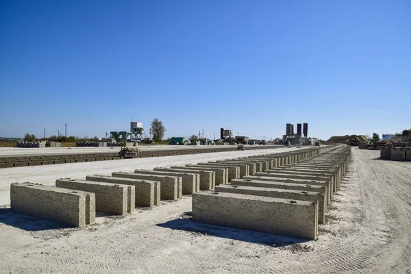 Cinder blocks lie on the ground and dried. on cinder block production plant.