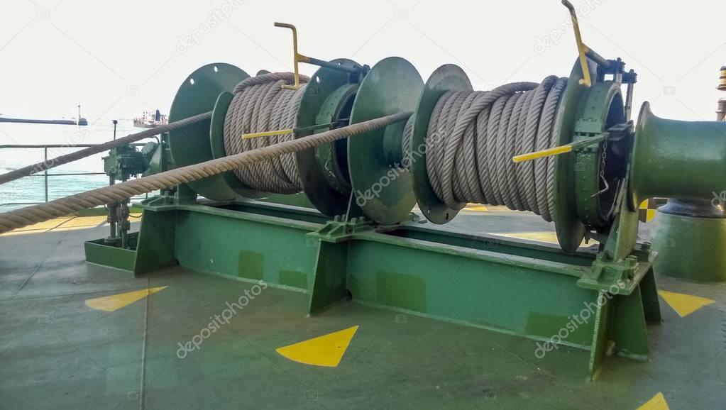 Mechanisms of tension control ropes. Winches. Equipment on the deck of a cargo ship or port