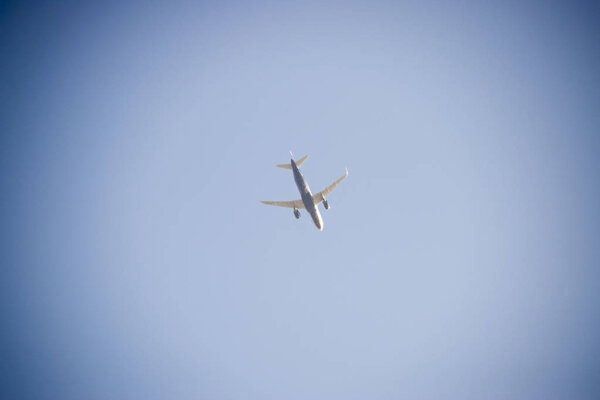 Passenger aircraft in the sky at low altitude flies to the airport to land.