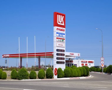 Gas station of the oil company Lukoil on the highway. clipart