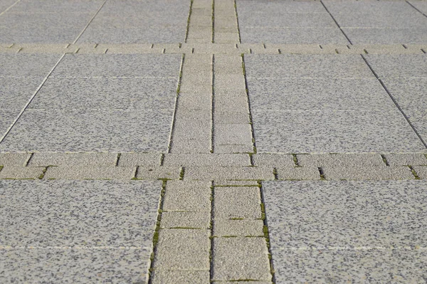 Figure out the paving slabs in the square. Background of paving