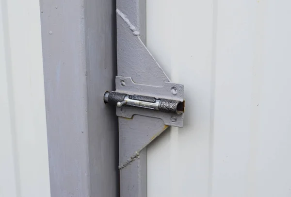 Latch on gate. A design for locking of gate from within.