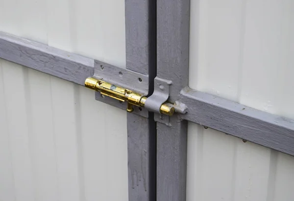 Latch on gate. A design for locking of gate from within.