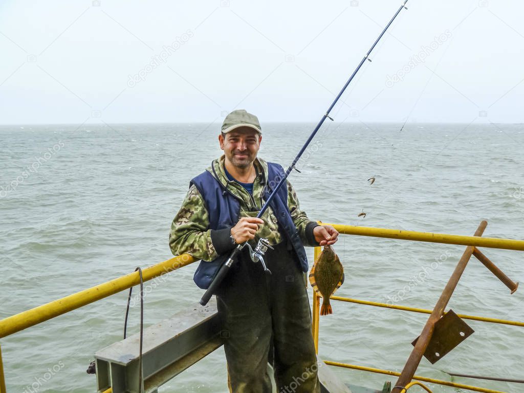 Flounder on the deck. Fishing on the boat. Bottom fish