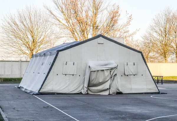 huge tent for a large group of people. Army headquarters tent. Awning canopy.