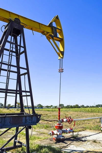 The pumping unit as the oil pump installed on a well. Equipment of oil fields.