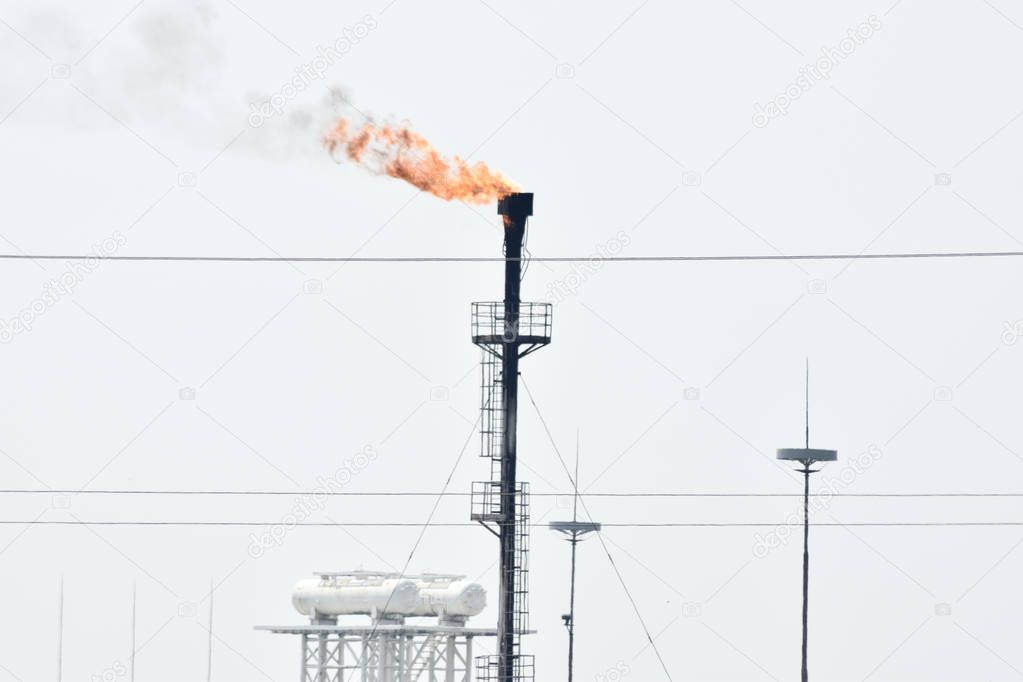 Torch system on an oil field