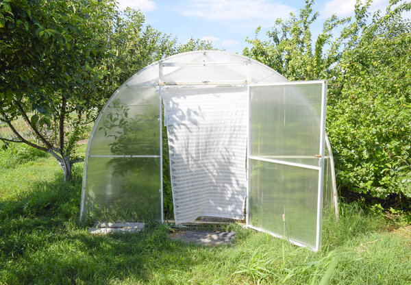 Greenhouse polycarbonate in a private garden
