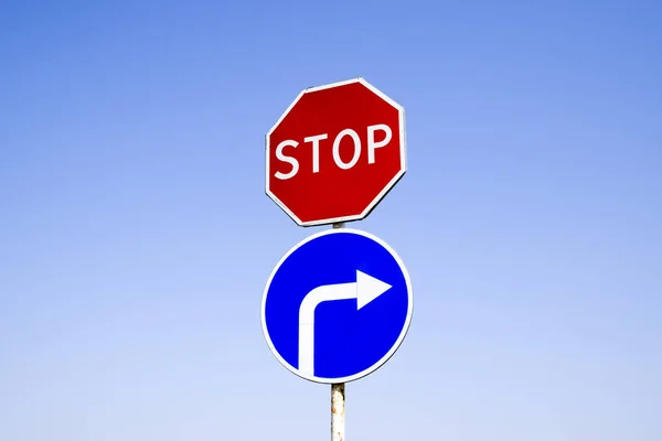 The road sign is stop. sign turn right.