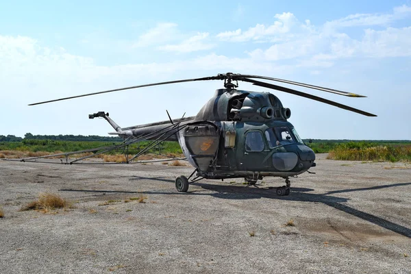 Old helicopter spraying fields