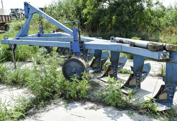 Plow on trailer for tractor. Plow for plowing soil. Trailer Hitch for tractors and combines. Trailers for agricultural machinery.