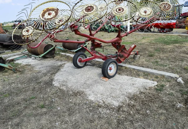 Tedder on trailer for tractor. The machine for gathering hay. Trailer Hitch for tractors and combines. Trailers for agricultural machinery.