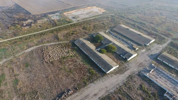 The building of an old farm for cattle. Top view of the farm. Storage of bales of hay on the old farm