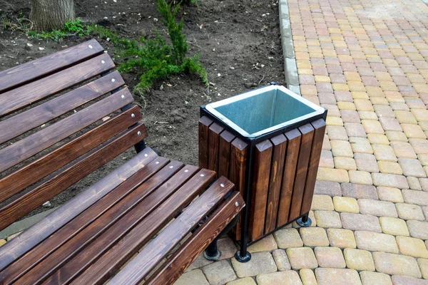 Benches in the park. Sidewalk tile in the park. Infrastructure of leisure in the park