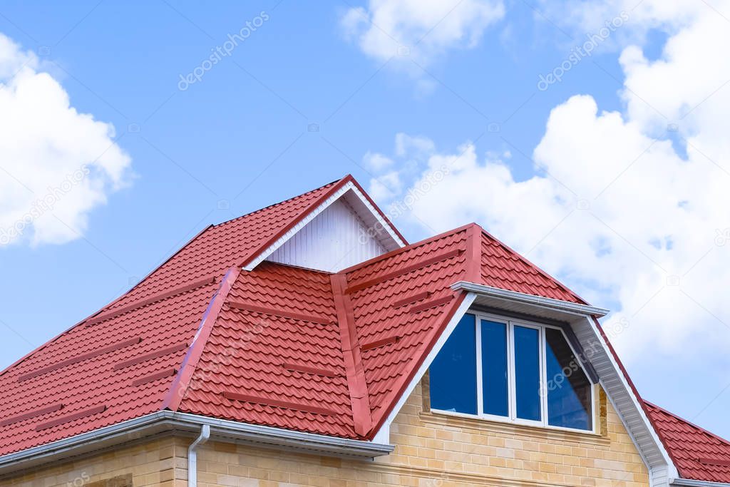 The house with plastic windows and a roof of corrugated sheet