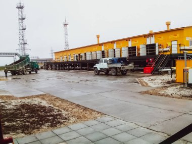 Yellow building - Oil pumping station for oil pumping. Oilfield