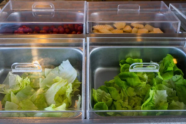 Salad vegetables in steel container with cover