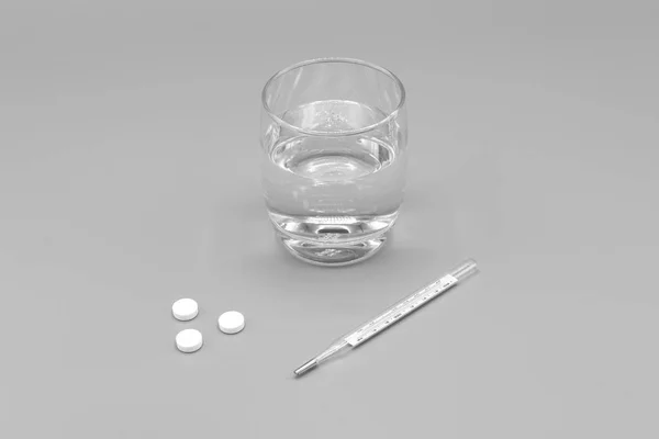 Pílulas brancas, termômetro e vidro de água em fundo cinza — Fotografia de Stock