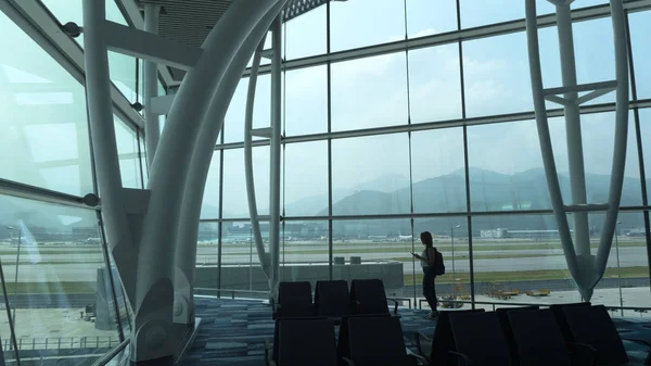 Girl at the airport window