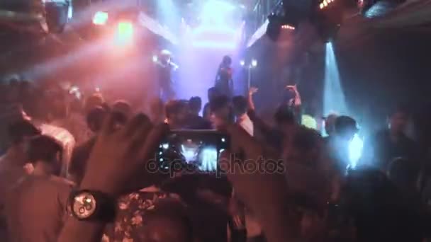 People taking photos or recording video with their smart phones at music concert — Stock Video