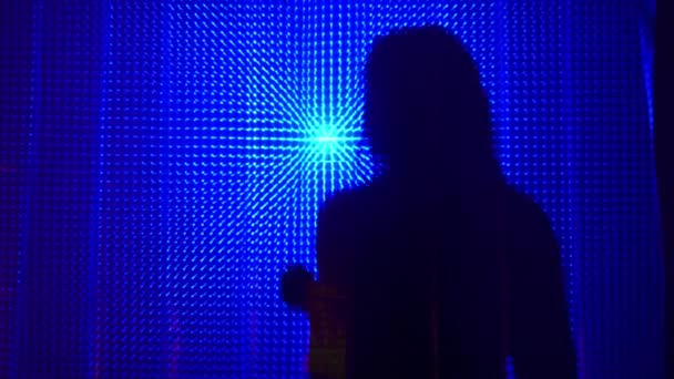 Beauty Model girl dancing shadow silhouette. Beautiful sexy young woman perfect slim body dance in uv light. Silhouette of a girl dancing in the shower behind the curtain — Stock Video