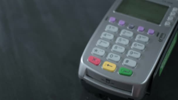 Pay by phone on the POS contactless payment terminal. A user makes a purchase using a smartphone in a store or restaurant. E-money at cashless wallet — Stock Video