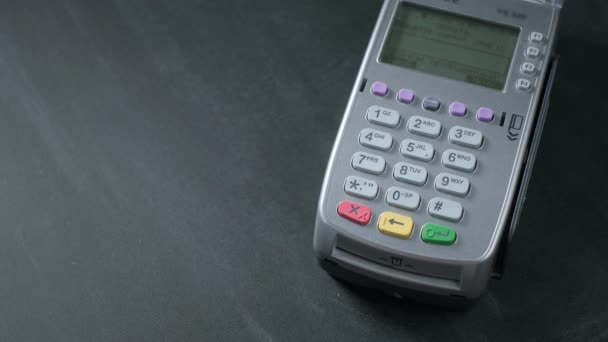 Pay by phone on the POS contactless payment terminal. A user makes a purchase using a smartphone in a store or restaurant. E-money at cashless wallet — Stock Video