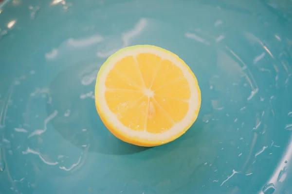 Yellow lemons isolated on blue background