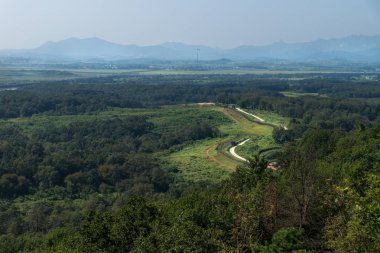Dora Observatory, DMZ, Korea - September 8 2017: View to North Korea Propaganda village or Peace Village at Korean Demilitarized Zone, with pole and flag of North Korea clipart