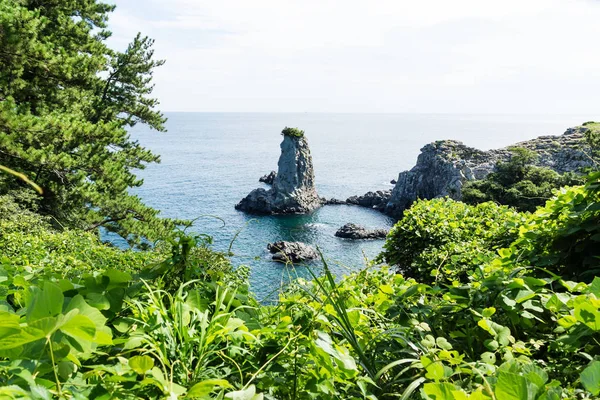 Rock formation Oedolgae in green halfcircle in the ocean at Seogwipo, Jeju Island, Korea — Stock Photo, Image