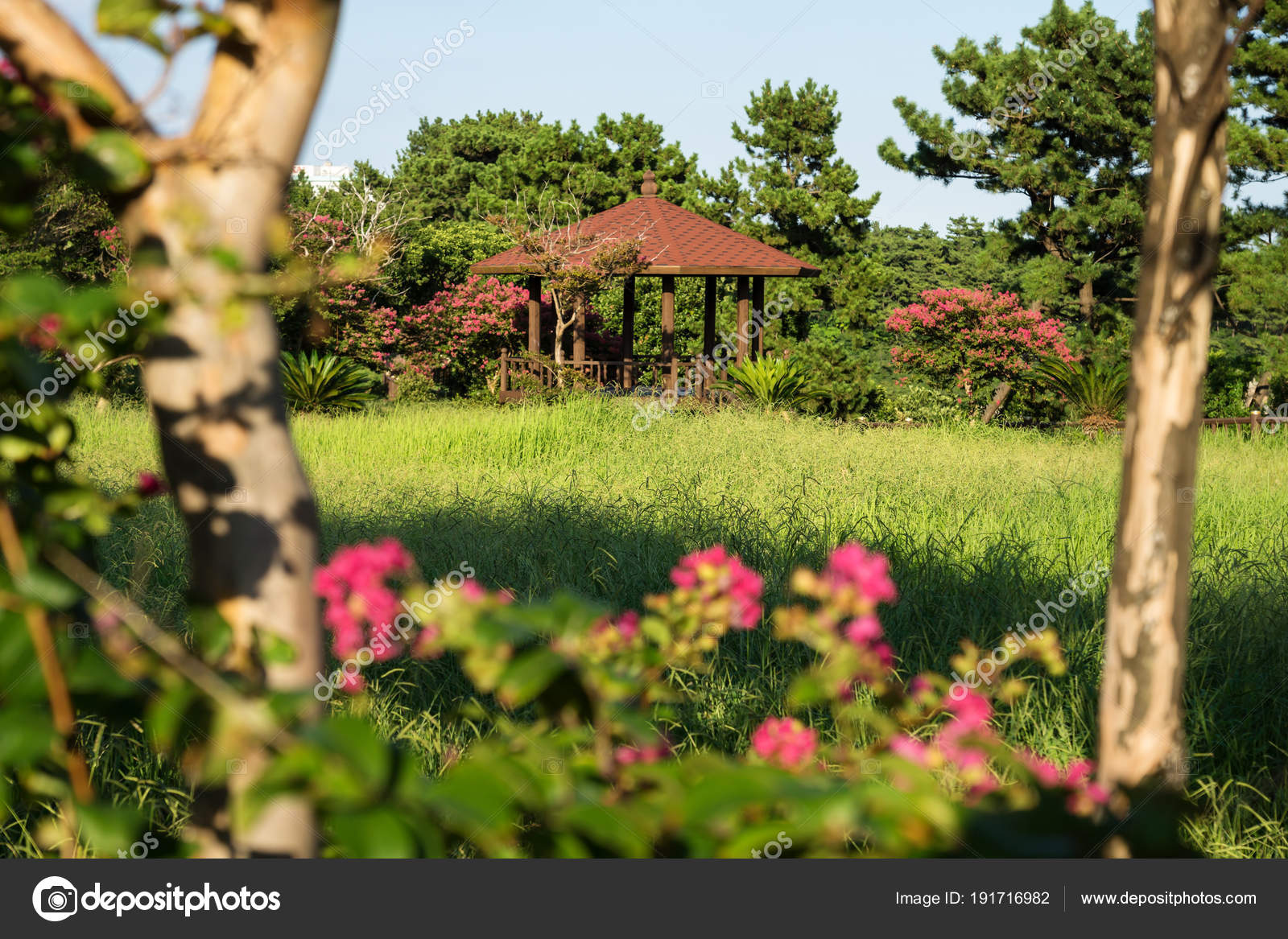 park with a little gardenhouse and flowers in seogwipo, jeju island