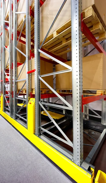 Warehouse racks metal dismountable constructions, modern warehouse technology background concept, vertical orientation, close-up with perspective, view from the bottom to top