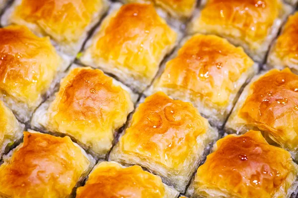 Baklava background. Jewish, turkish, arabic traditional national dessert. Macro. Selective focus. Oriental sweets, eastern sweets.