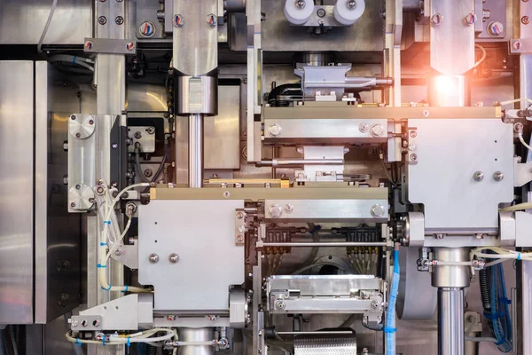 Industrial line for packaging of bakery products. Packing of bread at the factory.The machine for cutting and packing in a factory for the production of bread.