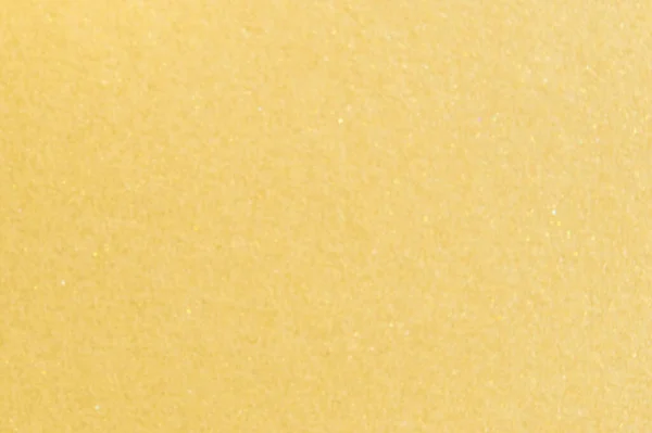 Açık sarı arkaplan ve küçük parlak detaylar