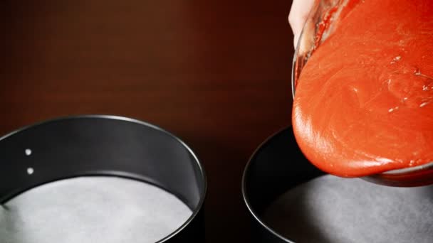 Cake batter pouring into baking dish. Making red velvet cake. — Stock Video