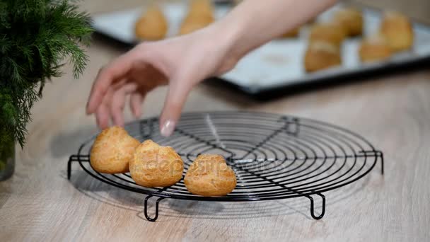Put the profiteroles on a rack to cool — Stock Video