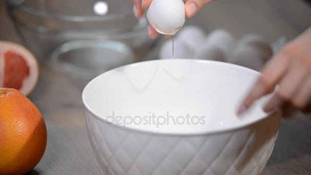 Female Hands Breaking Egg Separating Yolk White — Stock Video