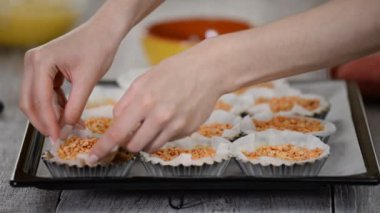 Pastry Chef Making Tartlets. Remove parchment and weights.