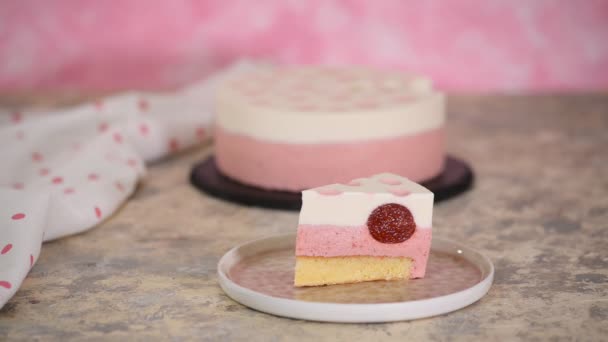 A piece of delicious strawberry mousse cake. Modern dessert. — Stock Video