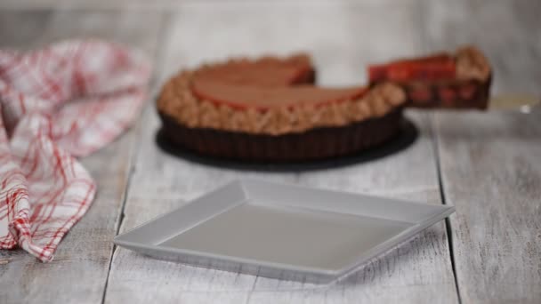 Piece of delicious chocolate tart with cherry confit and chocolate cream. — Stock Video