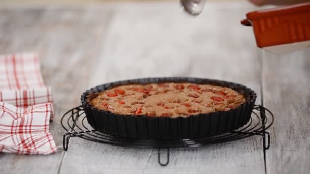 Pastry chef making chocolate tart with cherry and frangipane. — Stock Video
