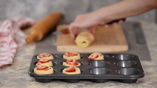 Female hands making buns with berry jam. — Stock Video