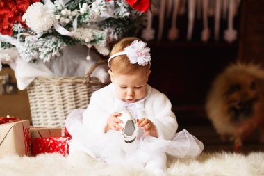 beautiful little girl in a white dress and wrap hair with a flow clipart